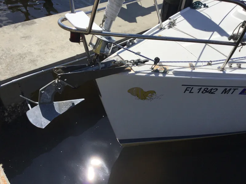 Slide: The Image of 1997 J Boats J/32 sailboat bow with anchor, docked in sunlight. - 7