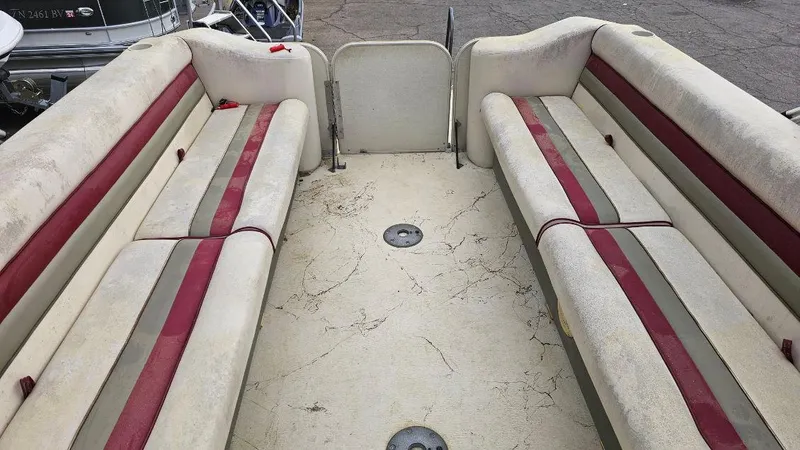 Slide: The Image of 2006 Fiesta 26' Fundeck L Sofa RE Deluxe interior with red and beige seating. - 6