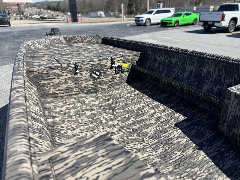 Slide: The Image of 2025 Havoc RDBST 1553 boat with camouflage interior, parked outdoors. - 7