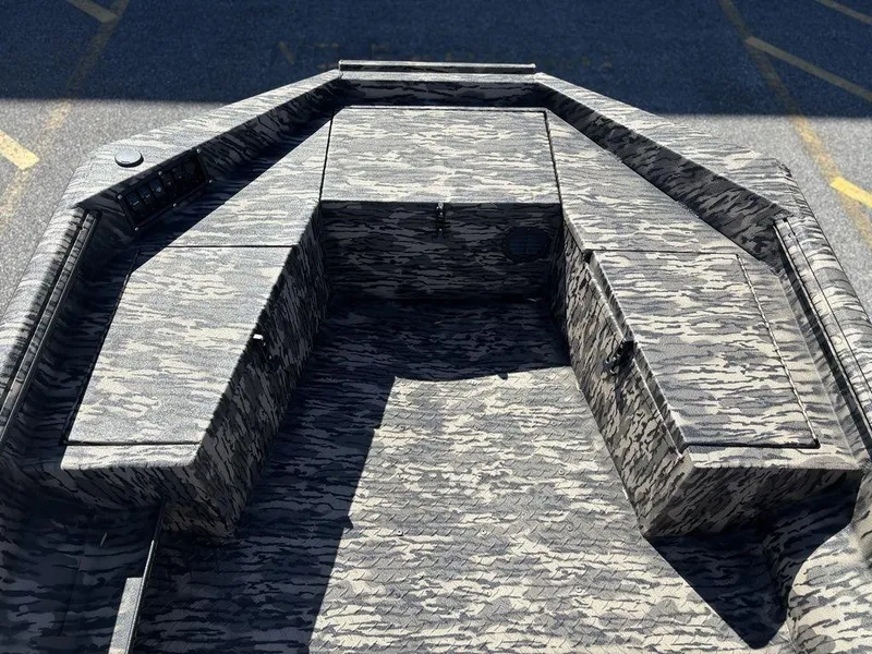 Slide: The Image of 2025 Havoc RDBST 1553 boat with camouflage pattern, featuring spacious seating and storage areas. - 9