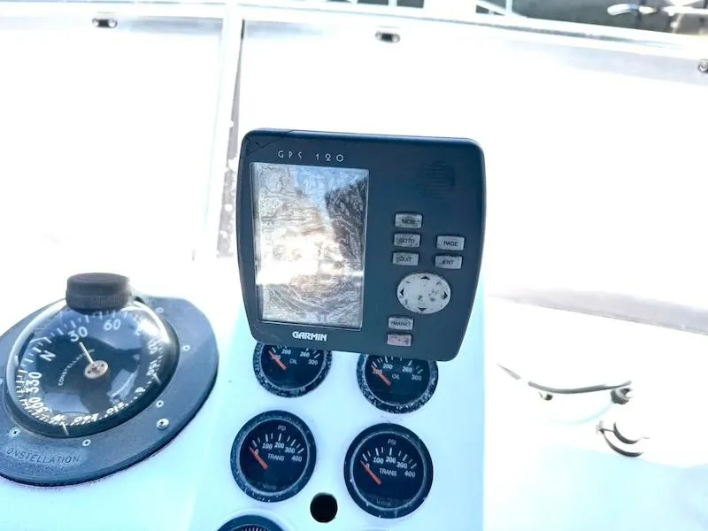 Slide: The Image of 1972 Trojan 36 boat dashboard with Garmin GPS and gauges. - 21