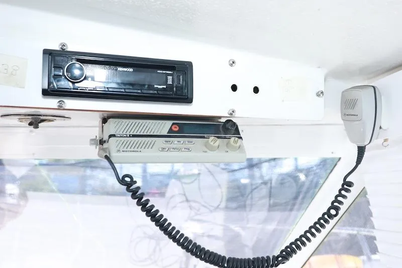 Slide: The Image of 1972 Trojan 36 boat interior with radio and communication equipment. - 23