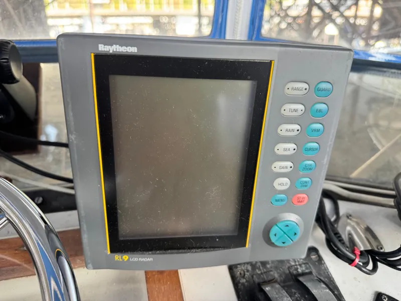 Slide: The Image of Raytheon RL9 LCD radar display on 1974 Roberts 30' boat dashboard. - 11