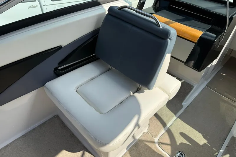 Slide: The Image of 2009 Four Winns SL222 boat interior with cushioned seating and modern design. - 12