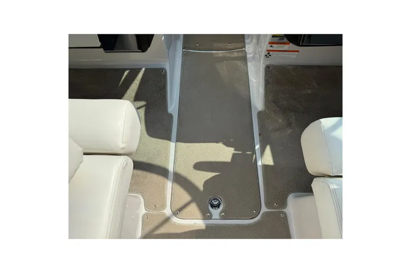 Slide: The Image of 2009 Four Winns SL222 boat interior with beige carpet and white seating. - 14