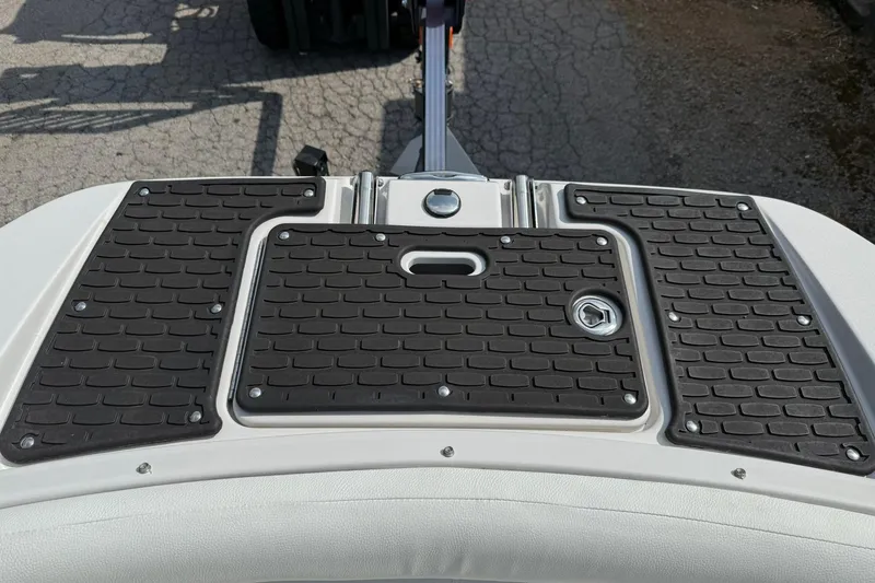 Slide: The Image of 2009 Four Winns SL222 boat swim platform with textured black grip pads. - 17