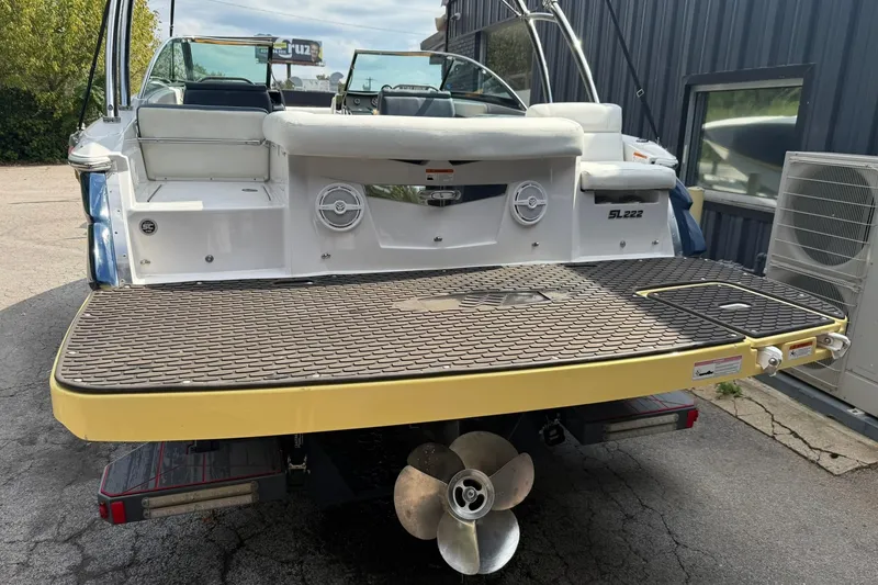 Slide: The Image of 2009 Four Winns SL222 boat rear view with swim platform and propeller. - 21