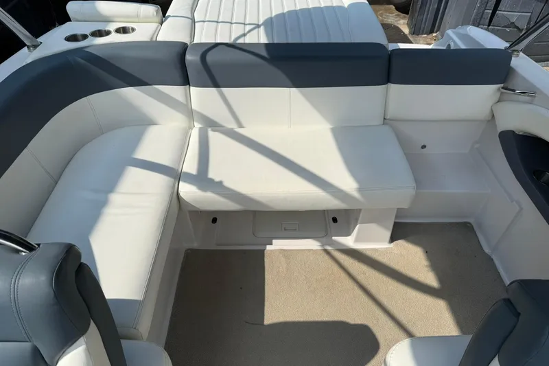 Slide: The Image of 2009 Four Winns SL222 boat interior with white and gray seating arrangement. - 23