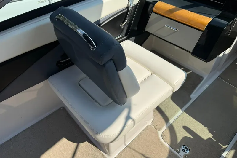 Slide: The Image of 2009 Four Winns SL222 boat interior with white seating and sleek design. - 8