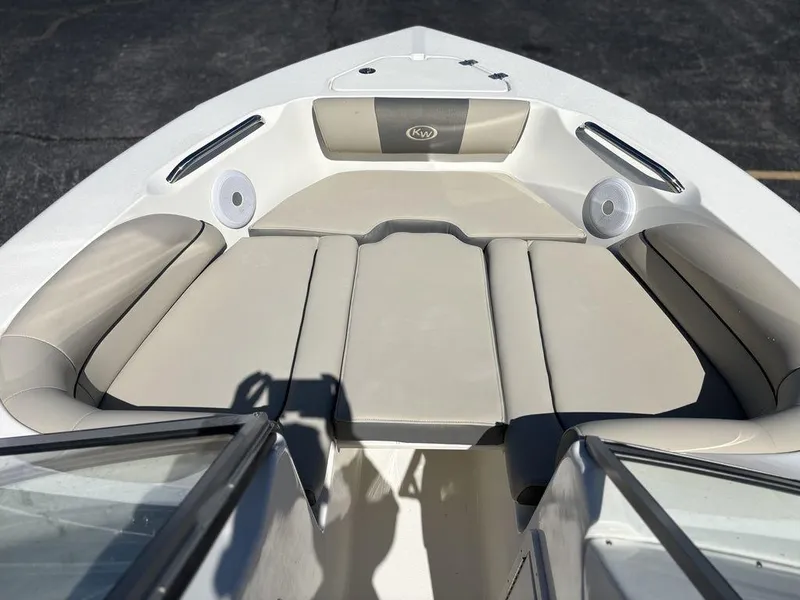 Slide: The Image of 2025 Key West 203 DFS boat interior with beige seating and speakers. - 10