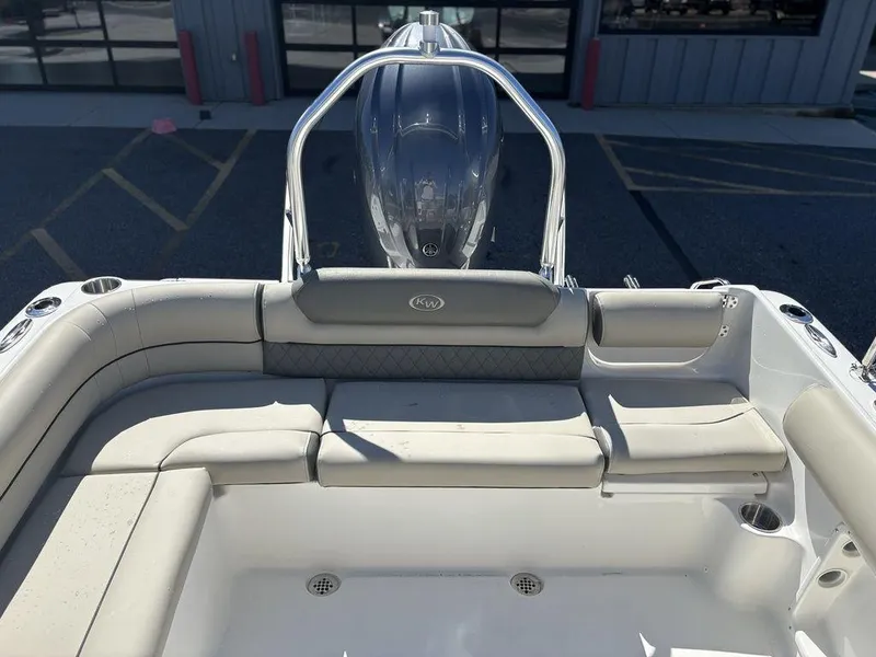 Slide: The Image of 2025 Key West 203 DFS boat interior with cushioned seating and sleek design. - 18