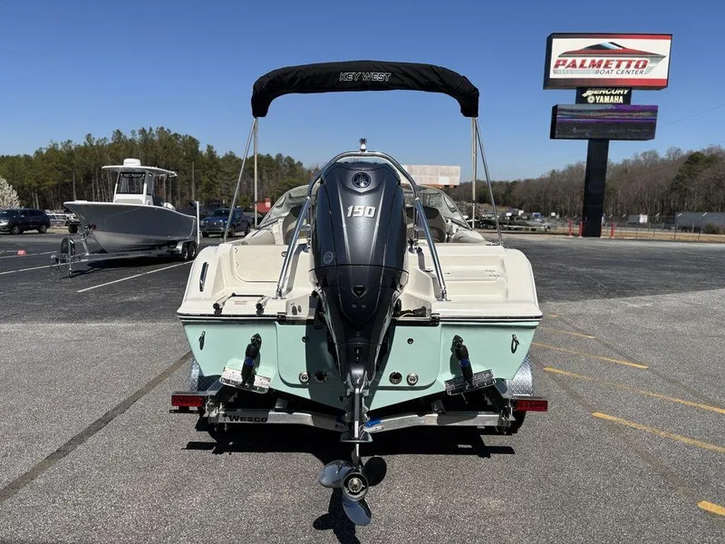 Slide: The Image of 2025 Key West 203 DFS boat with Yamaha 130 engine in parking lot. - 4