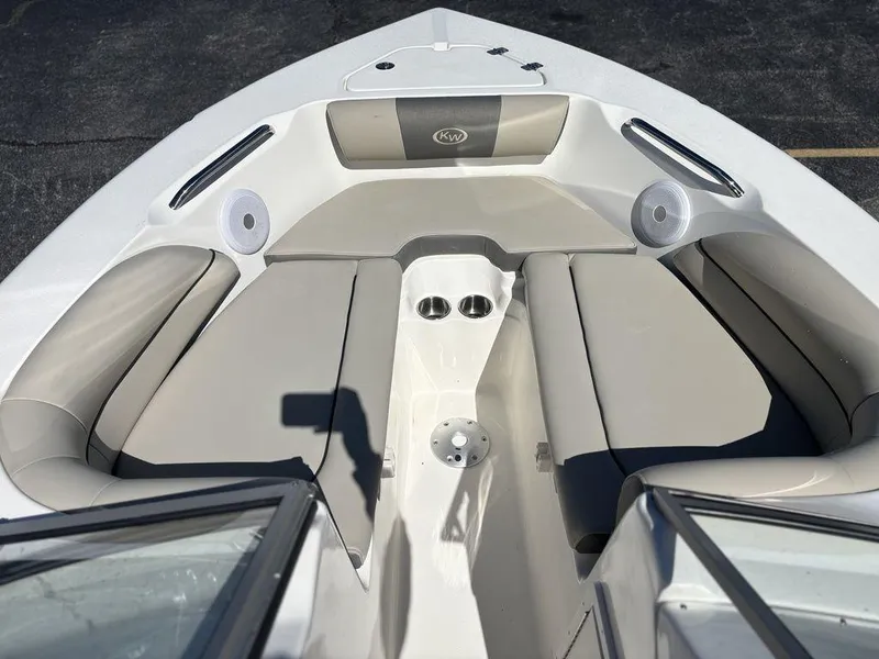 Slide: The Image of 2025 Key West 203 DFS boat interior with beige seating and cup holders. - 9