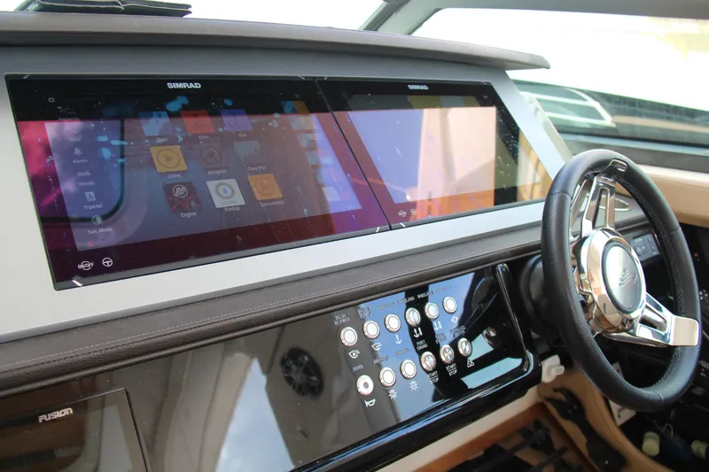 Slide: The Image of 2019 Sea Ray SLX 400 helm with advanced touchscreen navigation and control systems. - 12