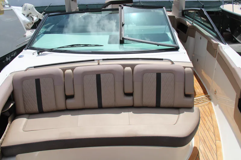 Slide: The Image of 2019 Sea Ray SLX 400 boat with beige seating and wooden deck. - 27