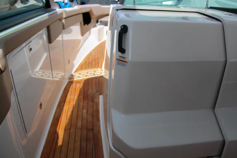 Slide: The Image of 2019 Sea Ray SLX 400 boat interior with teak flooring and sleek design. - 30