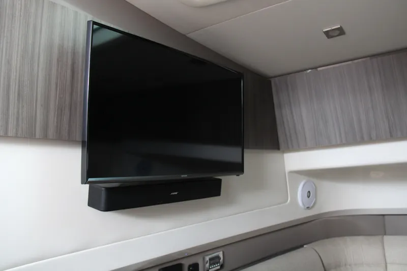 Slide: The Image of Flat-screen TV in 2019 Sea Ray SLX 400 cabin interior. - 31