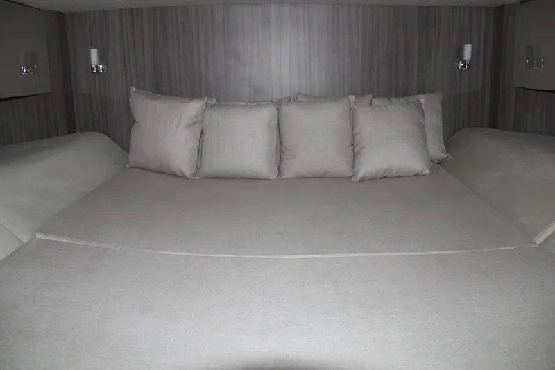 Slide: The Image of Luxurious cabin interior of 2019 Sea Ray SLX 400 with plush bedding and pillows. - 33