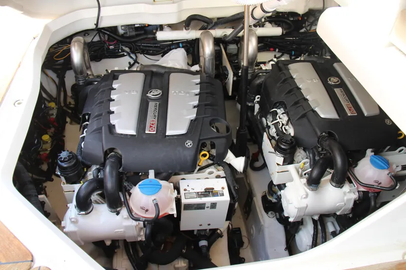 Slide: The Image of Engine compartment of a 2019 Sea Ray SLX 400 boat, featuring dual engines. - 38