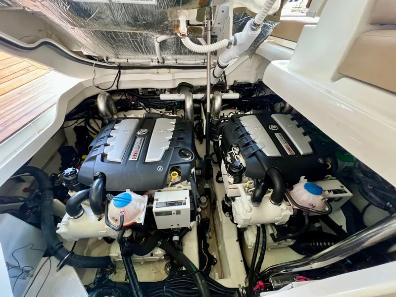 Slide: The Image of 2019 Sea Ray SLX 400 engine compartment with dual engines. - 39