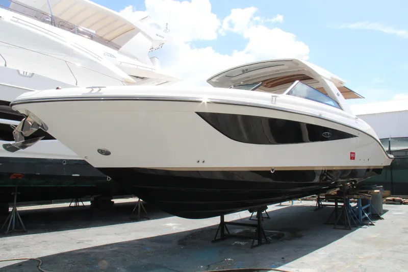 Slide: The Image of 2019 Sea Ray SLX 400 boat on stands, viewed from the side. - 4