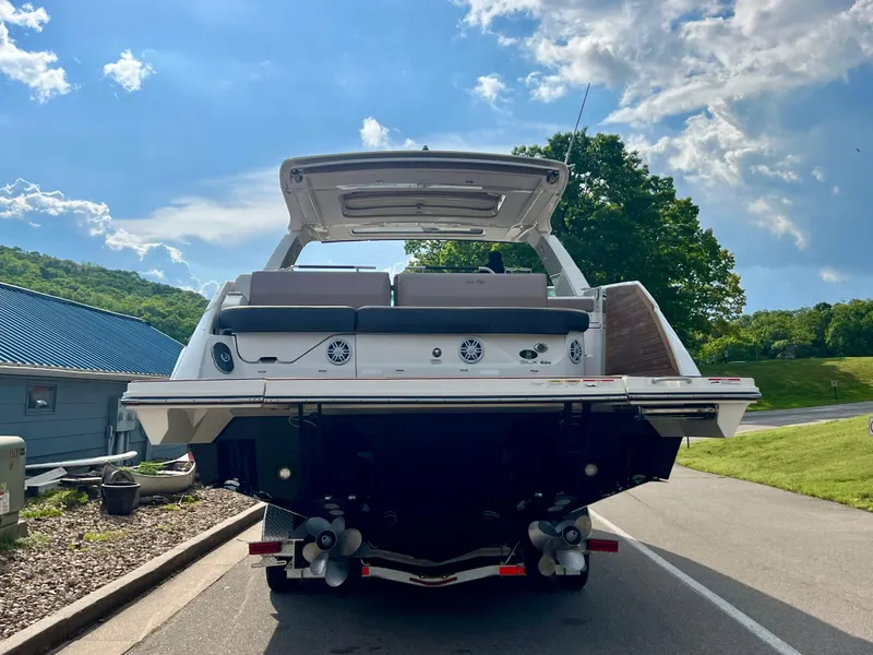Slide: The Image of 2019 Sea Ray SLX 400 boat on trailer, rear view, sunny day, scenic background. - 6
