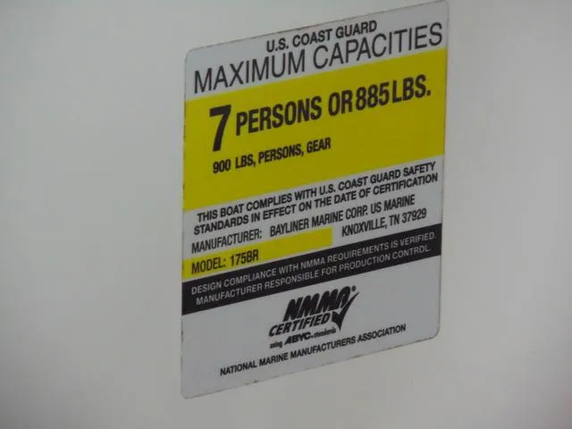 Slide: The Image of 2009 Bayliner 175 capacity label: 7 persons or 885 lbs, U.S. Coast Guard certified. - 12