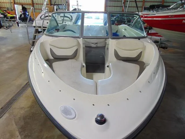 Slide: The Image of 2009 Bayliner 175 boat with open bow seating, displayed indoors. - 7