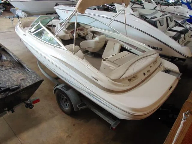 Slide: The Image of 2000 Maxum 1900SR boat on trailer in indoor storage facility. - 3