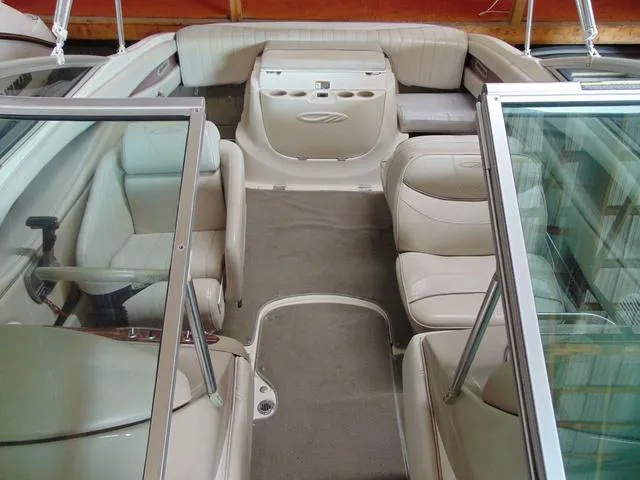 Slide: The Image of Interior of a 2000 Maxum 1900SR boat with beige seating and carpet. - 6