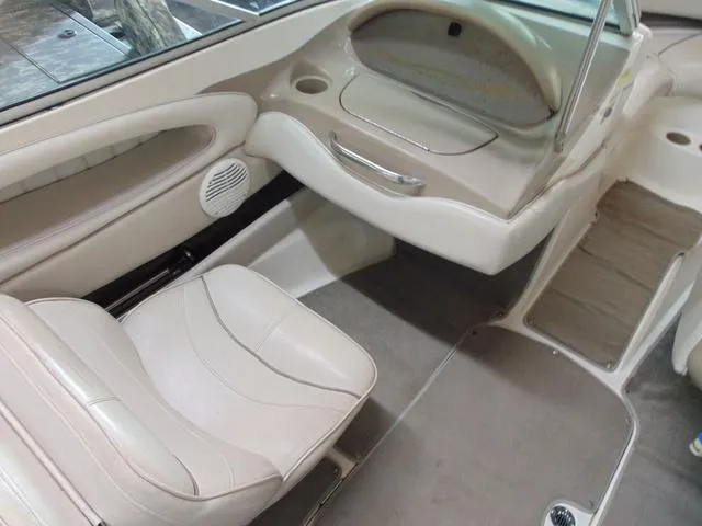 Slide: The Image of Interior of 2000 Maxum 1900SR boat with beige seating and dashboard. - 9