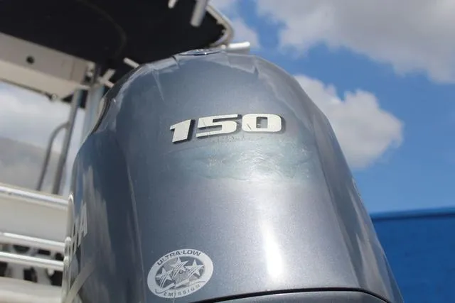 Slide: The Image of 2018 Robalo R180 boat with 150 horsepower engine, ultra-low emission sticker visible. - 10