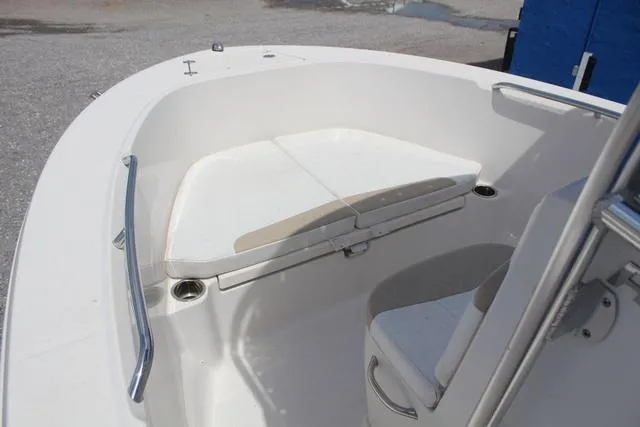 Slide: The Image of 2018 Robalo R180 boat interior with seating and stainless steel railings. - 14