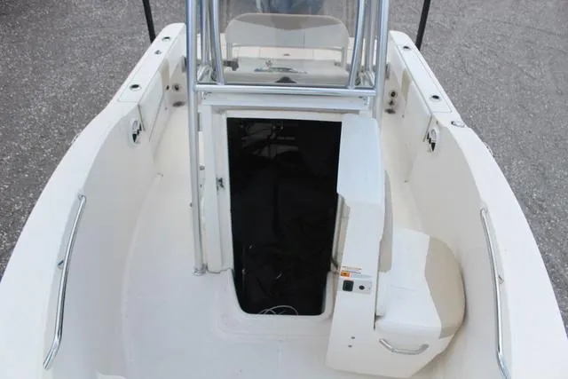 Slide: The Image of 2018 Robalo R180 boat interior with open storage compartment. - 16
