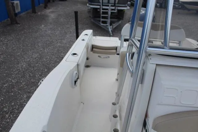Slide: The Image of 2018 Robalo R180 boat interior, featuring seating and storage compartments. - 17
