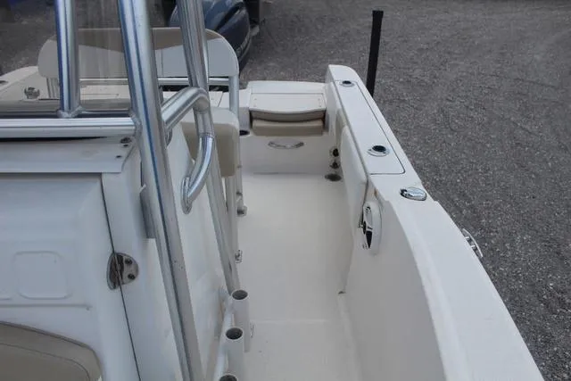 Slide: The Image of 2018 Robalo R180 boat interior with seating and rod holders. - 18