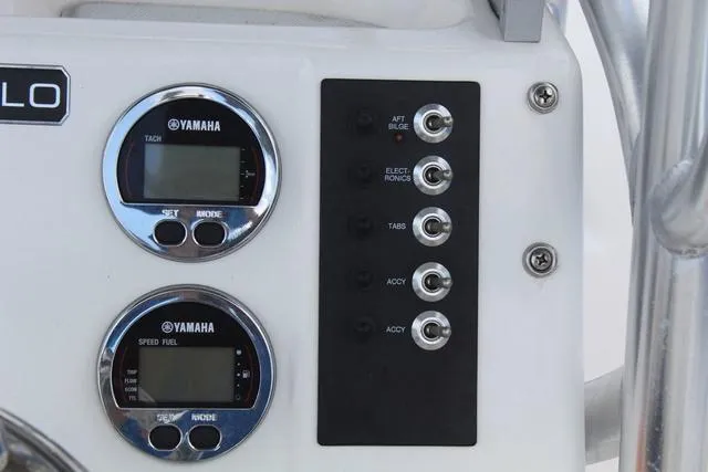 Slide: The Image of Control panel of a 2018 Robalo R180 boat with Yamaha gauges and switches. - 22
