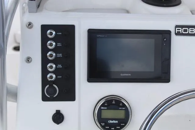 Slide: The Image of Control panel of 2018 Robalo R180 boat with Garmin GPS and Clarion audio system. - 23