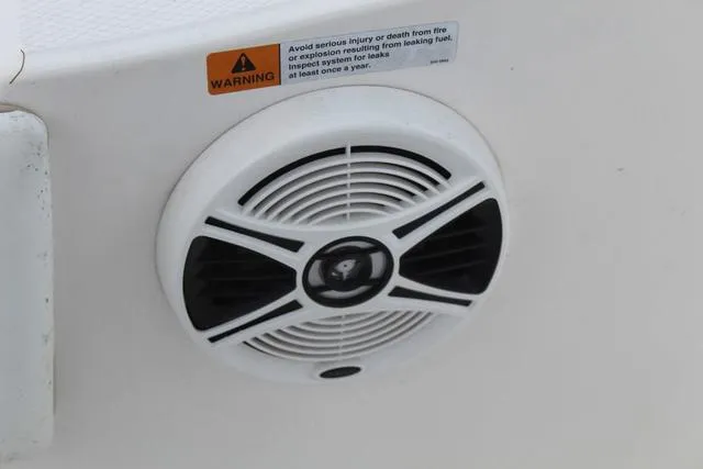 Slide: The Image of Speaker on 2018 Robalo R180 boat with safety warning label. - 24