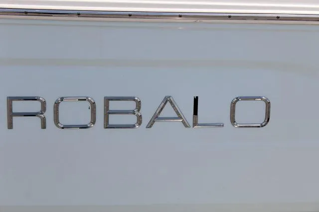 Slide: The Image of Robalo R180 2018 boat logo on white surface. - 8