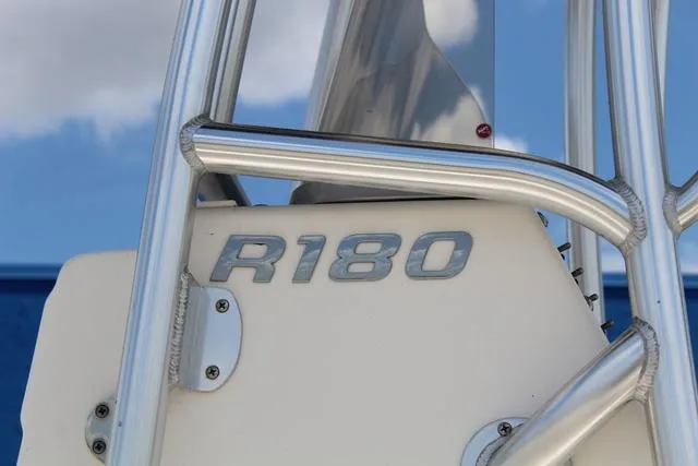 Slide: The Image of 2018 Robalo R180 boat detail with metal framework against blue sky. - 9
