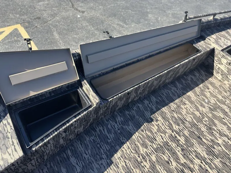 Slide: The Image of Open storage compartments on a 2025 Havoc DBST 1656 boat, showcasing interior space. - 10