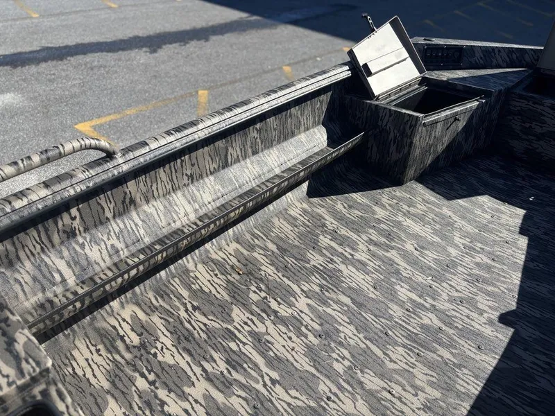 Slide: The Image of 2025 Havoc DBST 1656 boat interior with camouflage pattern and storage compartment. - 11