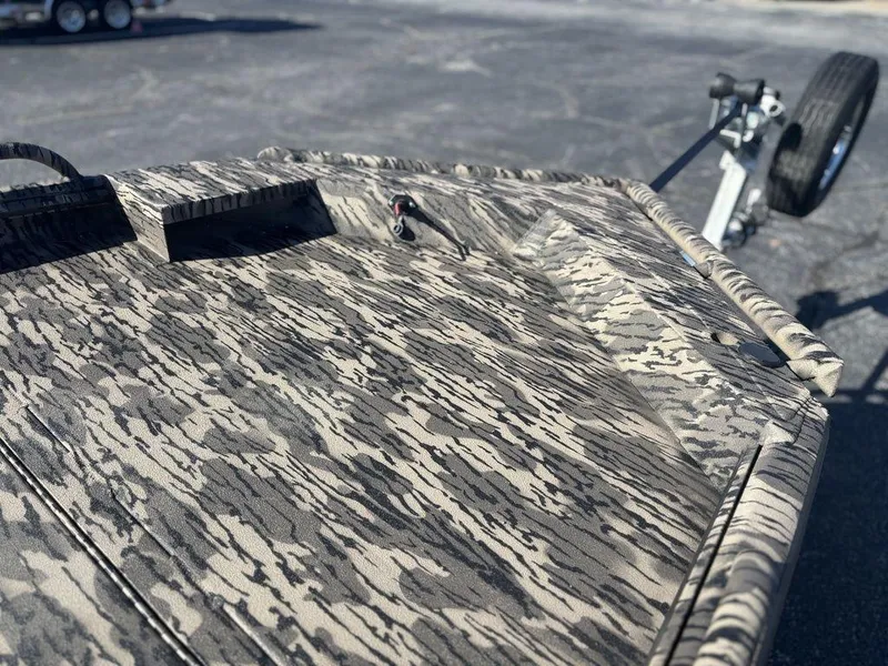 Slide: The Image of 2025 Havoc DBST 1656 boat with camouflage pattern on a trailer. - 12