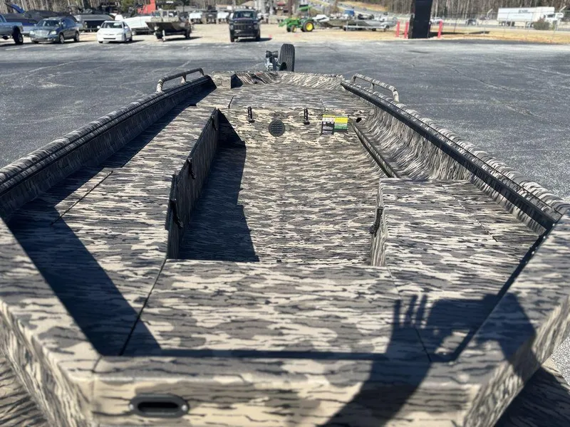 Slide: The Image of 2025 Havoc DBST 1656 boat with camouflage design in a parking lot. - 5