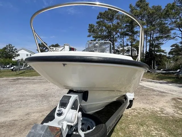 Slide: The Image of 1999 Boston Whaler 160 Dauntless boat on trailer, parked outdoors, sunny day. - 2