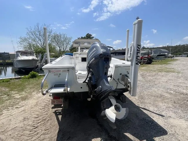 Slide: The Image of 2017 Sportsman 17' Island Reef boat with Yamaha motor, parked on a sunny day. - 4