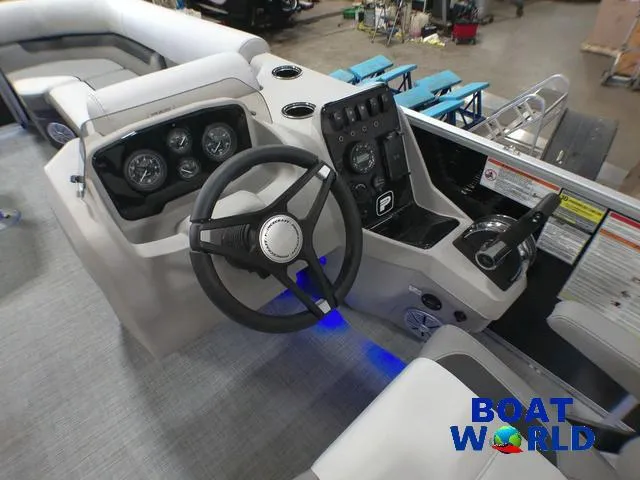 Slide: The Image of 2025 Princecraft Vectra 21 Cruise Lounge boat dashboard with steering wheel and controls. - 13