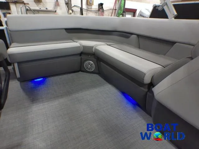 Slide: The Image of 2025 Princecraft Vectra 21 Cruise Lounge interior with gray seating and blue LED lighting. - 23