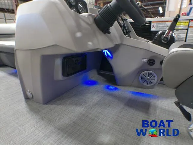Slide: The Image of 2025 Princecraft Vectra 21 Cruise Lounge interior with blue LED lighting and steering console. - 24